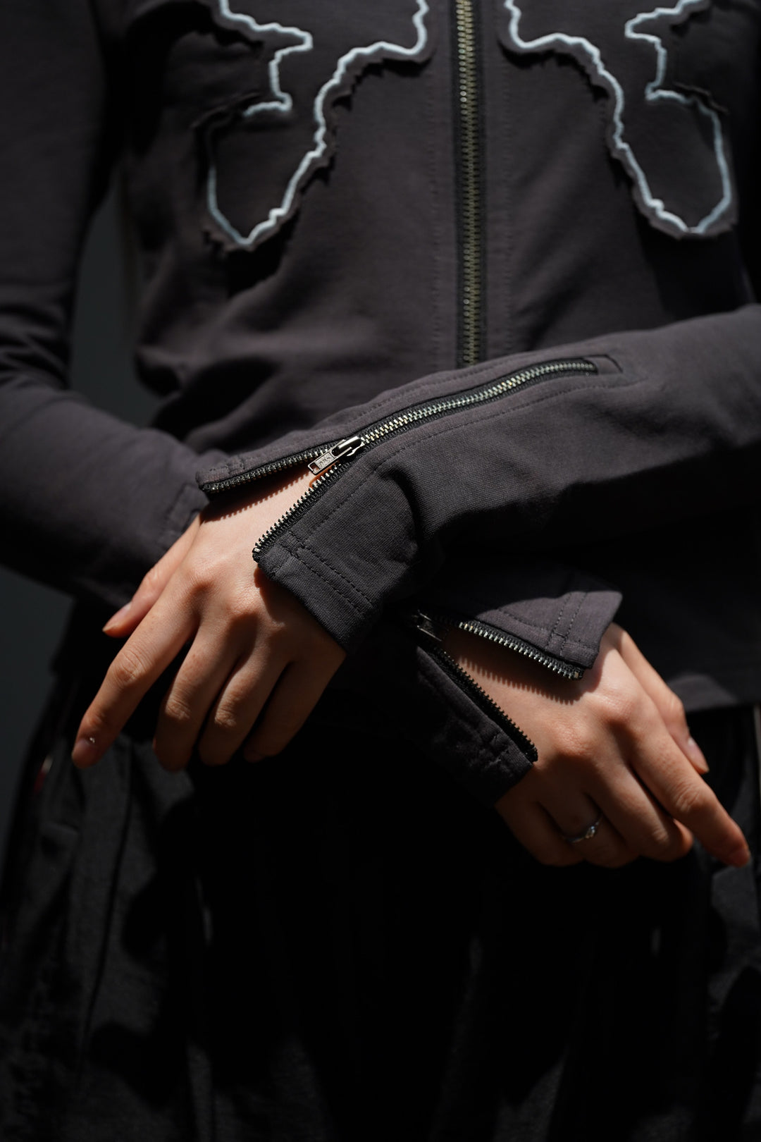 P.A.M.(Perks and Mini)(パム)のKOSMIC KISS ZIPPED CARDIGAN(WET