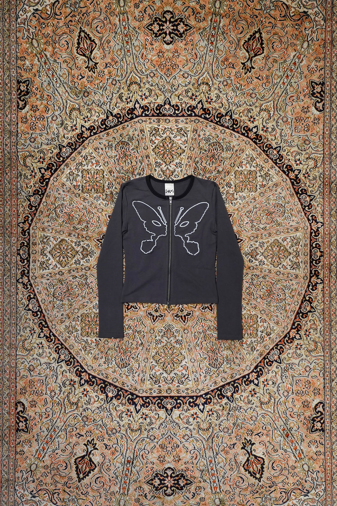 P.A.M.(Perks and Mini)(パム)のKOSMIC KISS ZIPPED CARDIGAN(WET