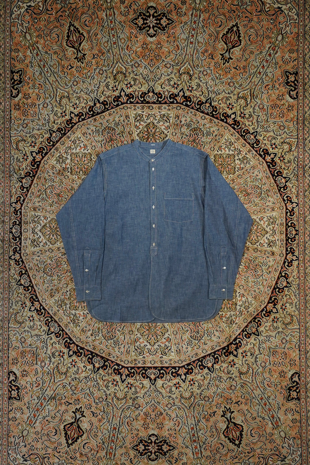 Taiga Takahashi(タイガタカハシ)のBAND COLLAR SHIRT(INDIGO CHAMBRAY