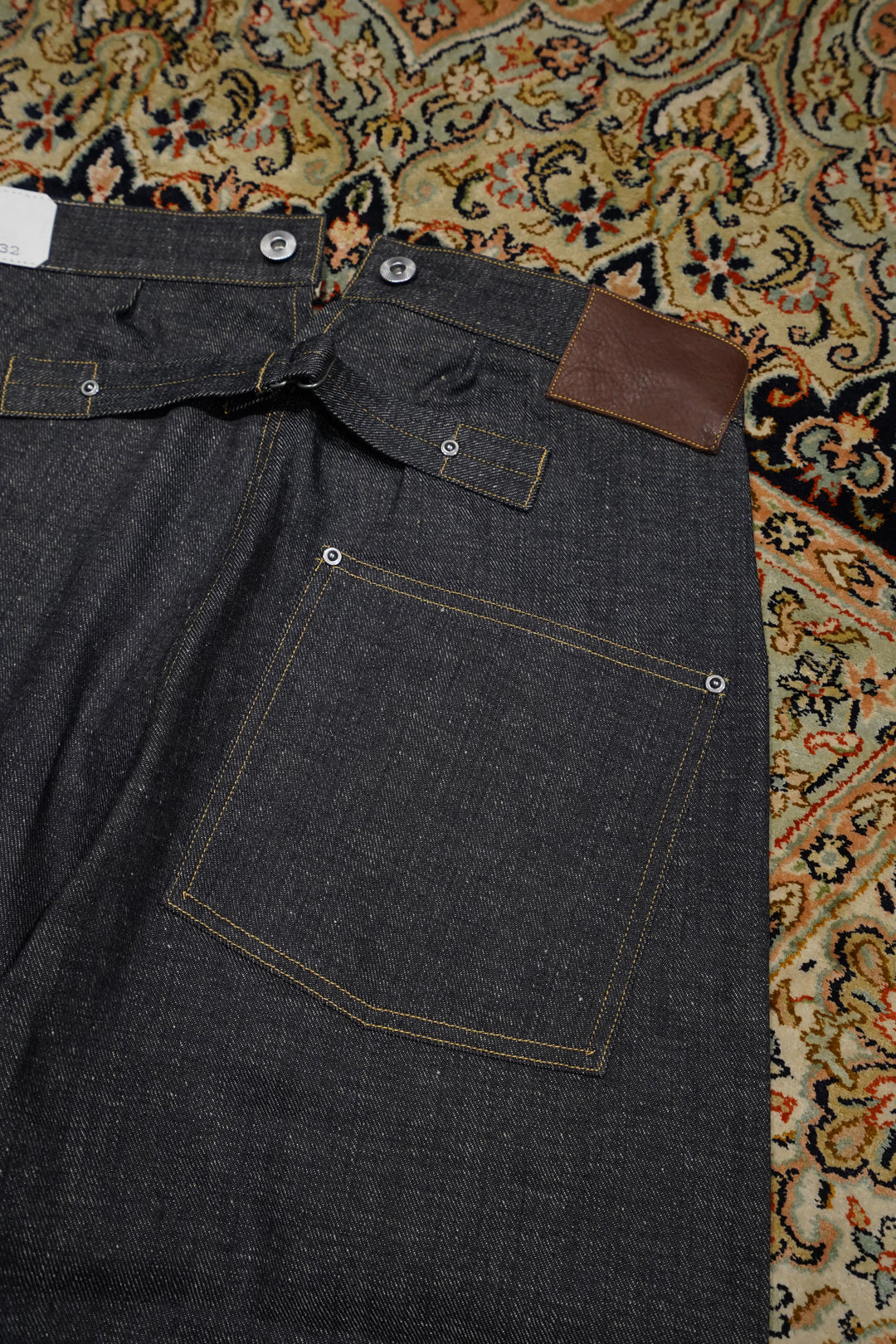 Taiga Takahashi(タイガタカハシ)のBUCKLE-BACKED DENIM TROUSERS(RAW